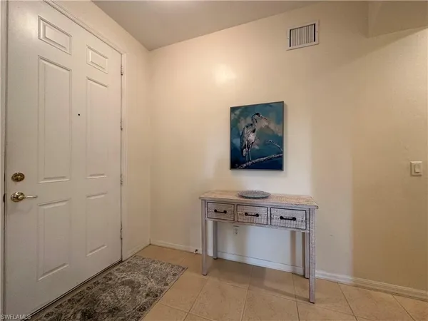 a view of a hallway with washer and dryer