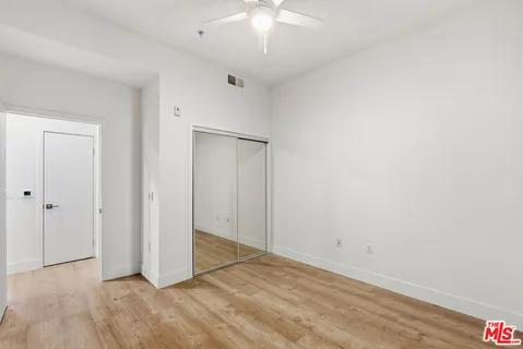 a bathroom with a granite countertop sink a toilet and a bathtub