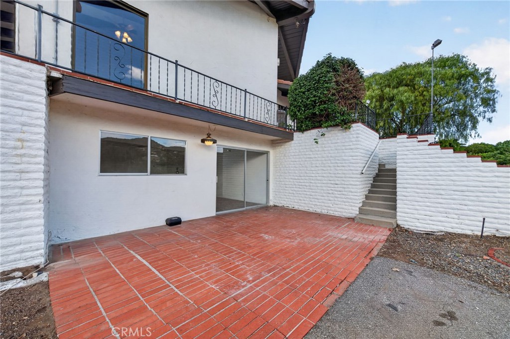 2801 East Mission Road Fallbrook, CA 92028 - Photo 35 of 62 Patio and entry into the basement bonus rooms (additional living space)