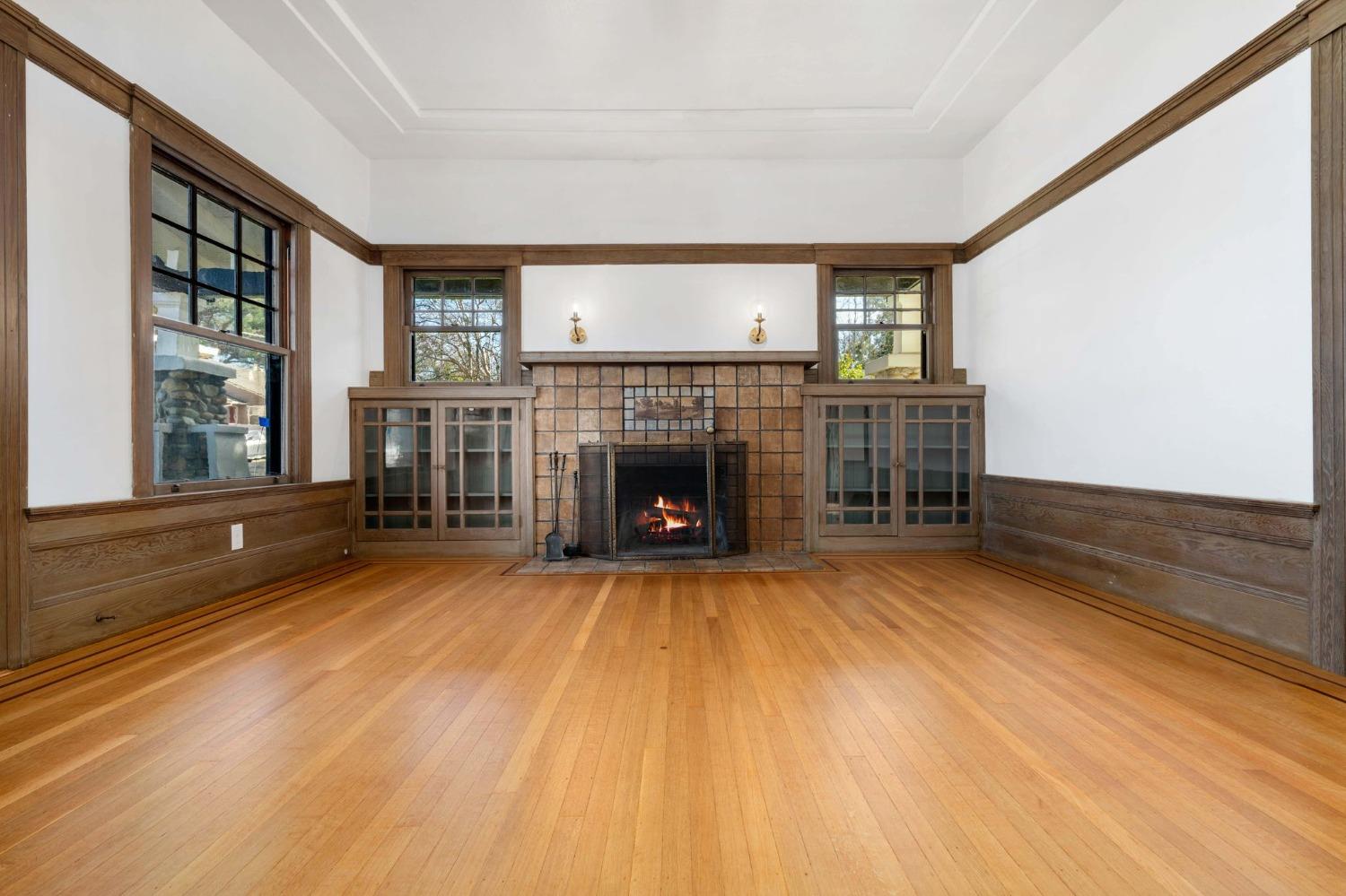 104 King Road Roseville, CA 95678 - Photo 12 of 36 a view of empty room with wooden floor and fireplace