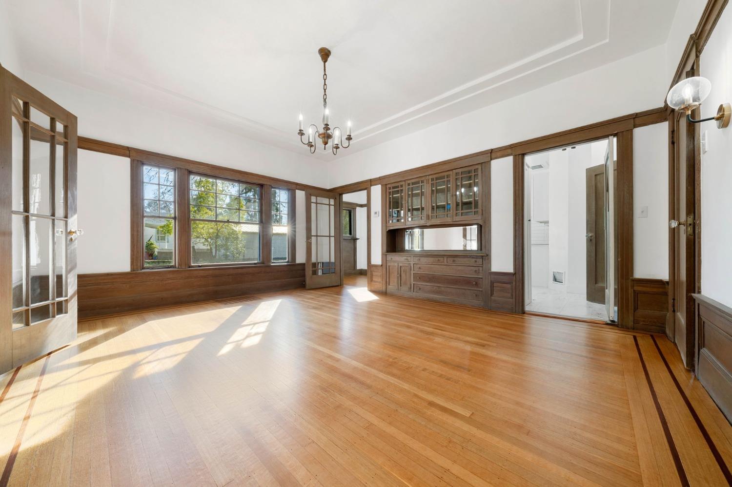 104 King Road Roseville, CA 95678 - Photo 13 of 36 a view of an empty room with a window and wooden floor
