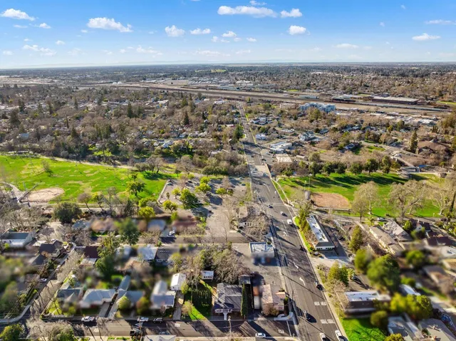 an aerial view of residential houses with outdoor space