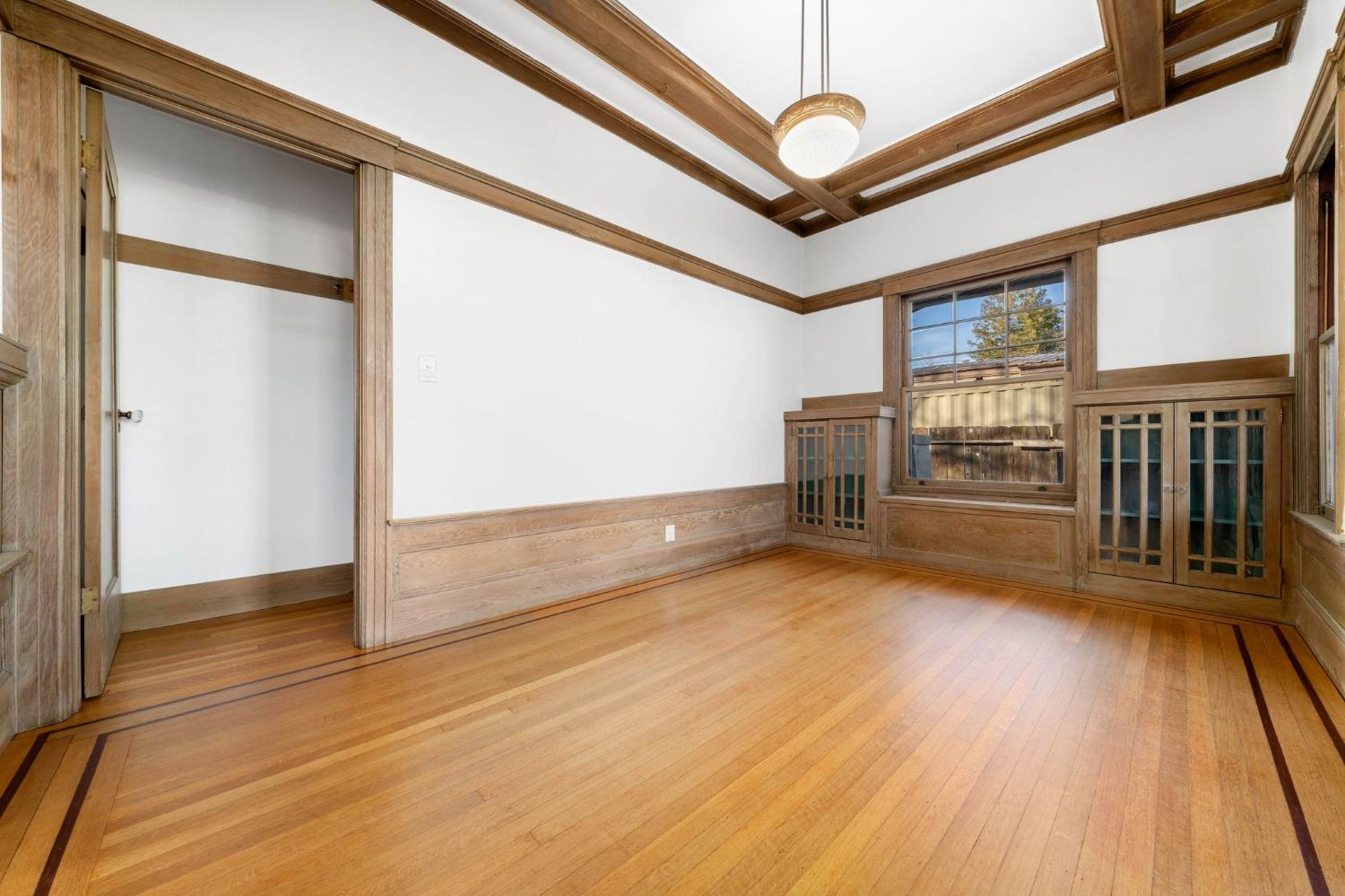 104 King Road Roseville, CA 95678 - Photo 10 of 36 an empty room with wooden floor and windows