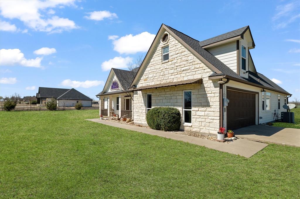 2885 Enloe Road Howe, TX 75459 - Photo 13 of 39 a view of house with backyard and garden