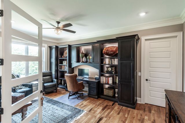 a bedroom with a large bed and a large window