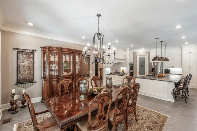 a swimming pool view with a outdoor seating