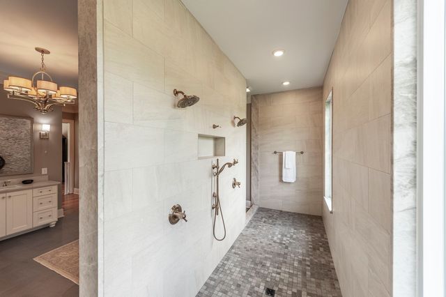 a front view of a house with entryway and outdoor seating