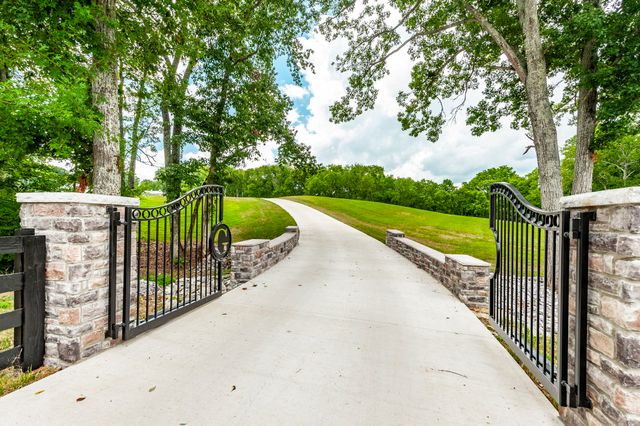 a living room with furniture a rug and a window