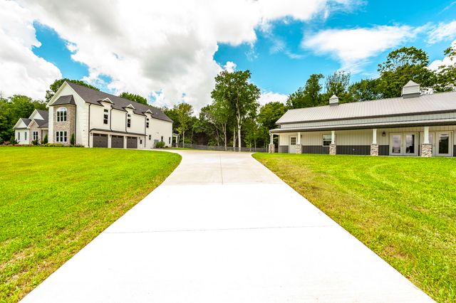 a workspace with furniture bookshelf and a window