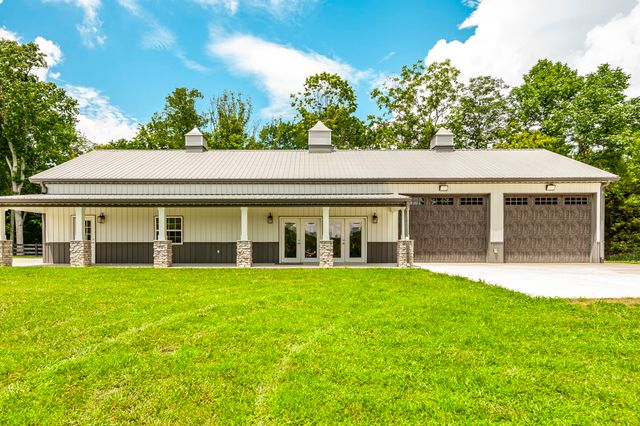 a living room with fireplace furniture and a flat screen tv