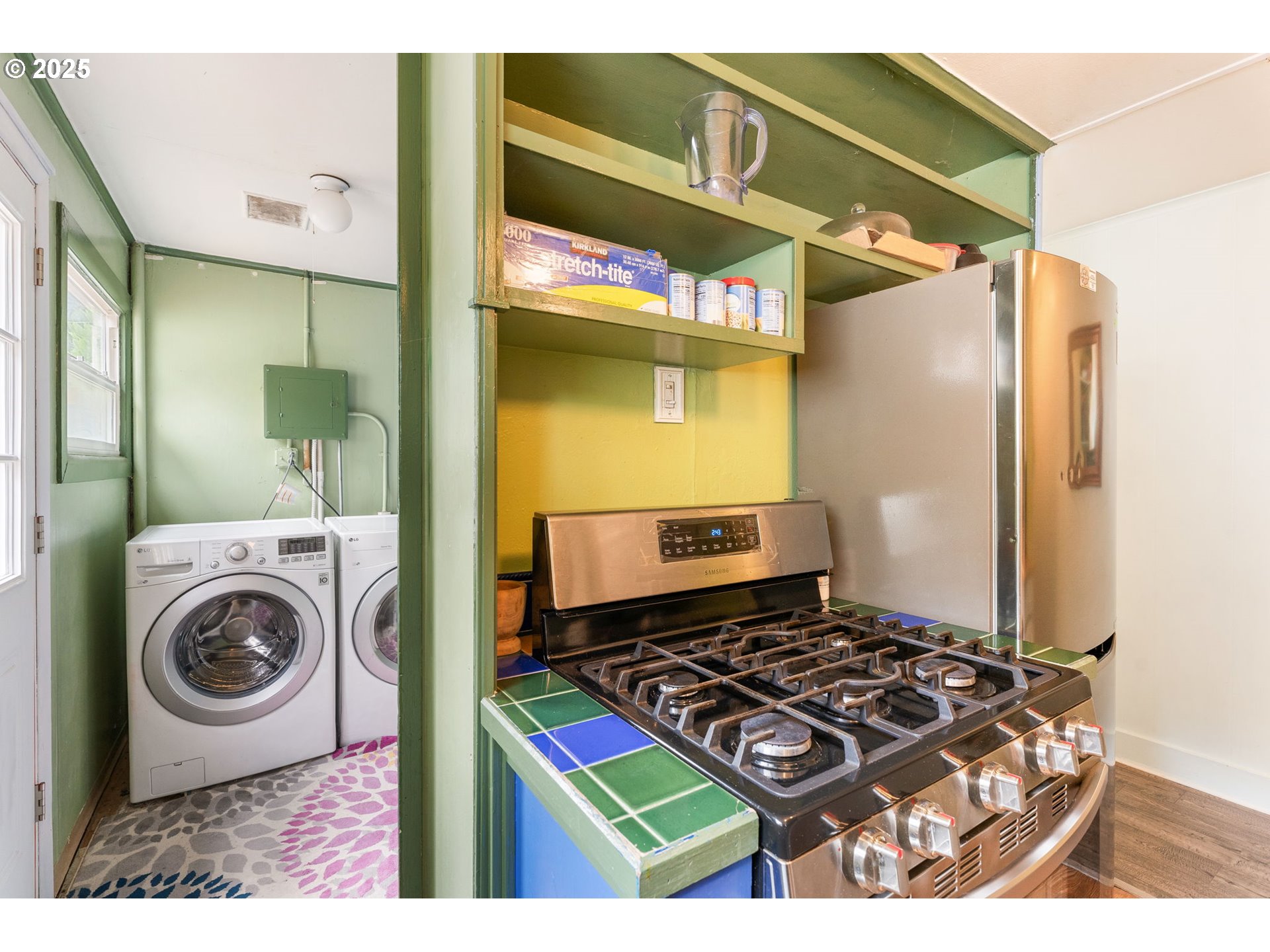 11870 Southwest 13th Street Beaverton, OR 97005 - Photo 23 of 32 a kitchen with a stove and a refrigerator