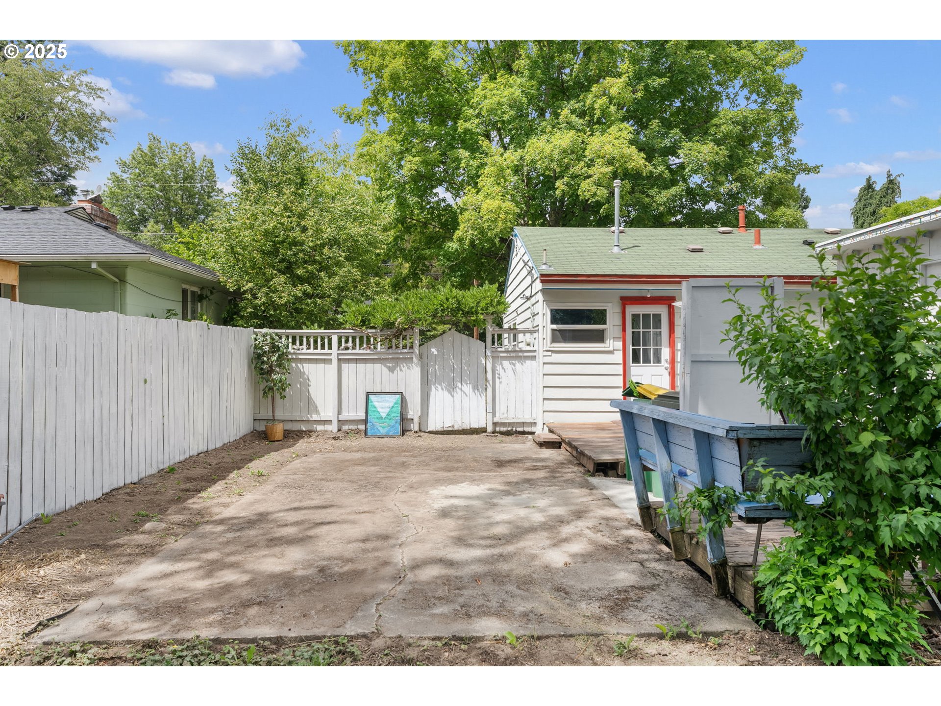 11870 Southwest 13th Street Beaverton, OR 97005 - Photo 31 of 32 a front view of a house with a yard and trees