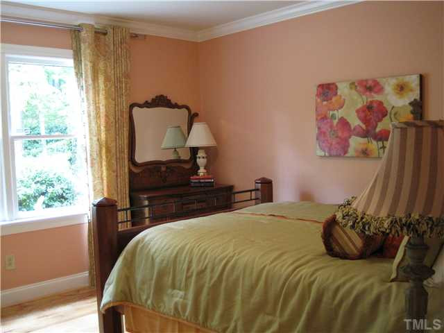8813 Brandon Station Road Raleigh, NC 27613 - Photo 11 of 18 Warm colors throughout to welcome you and your guests home. Bedroom