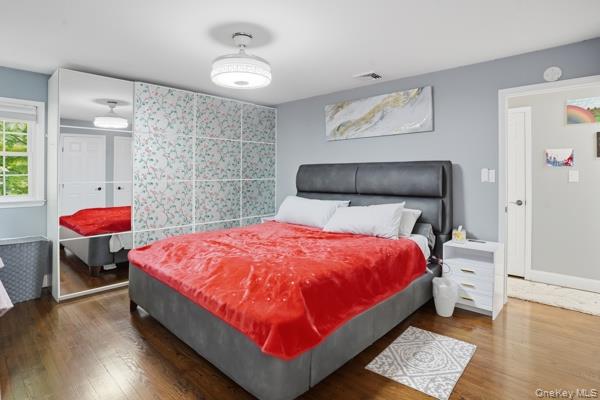 31 Laura Road Monroe, NY 10950 - Photo 20 of 39 a bed room with a bed and a lamp