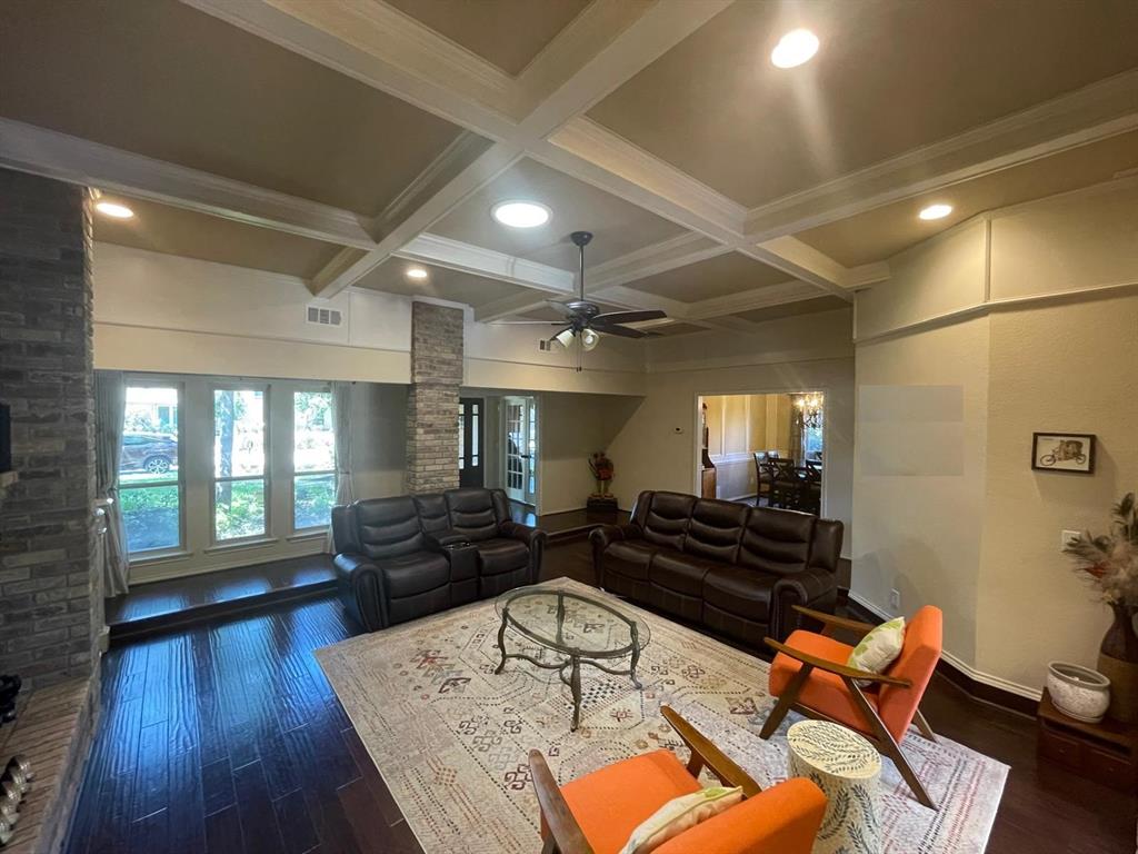3612 Cross Bend Road Plano, TX 75023 - Photo 15 of 38 Living room featuring beam ceiling, coffered ceiling, ceiling fan, and dark wood-type flooring
