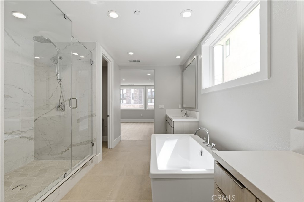 156 Apron Irvine, CA 92618 - Photo 21 of 40 a bathroom with a sink and a shower
