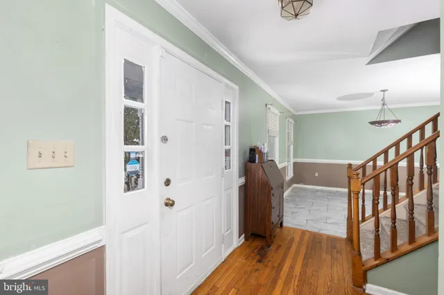 a kitchen with stainless steel appliances granite countertop a refrigerator sink stove microwave and cabinets