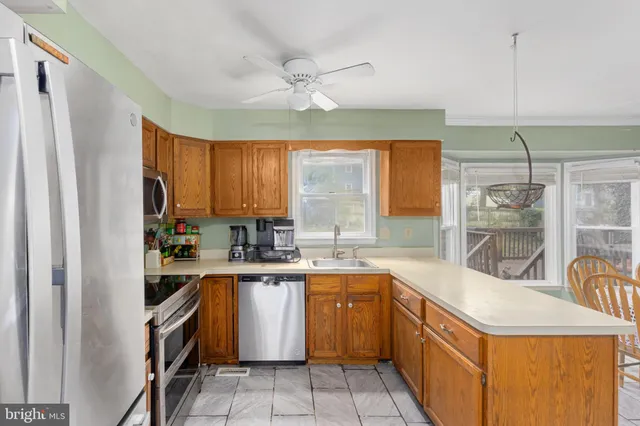 an empty room with a fireplace and window
