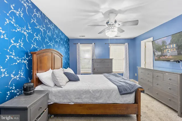 a view of a roof deck with table and chairs and wooden floor