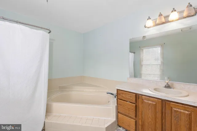 a view of a chair and table on the deck