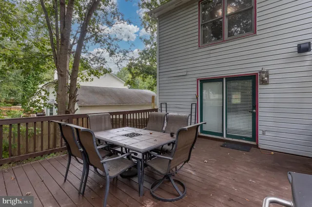 a view of a swimming pool with a yard and furniture