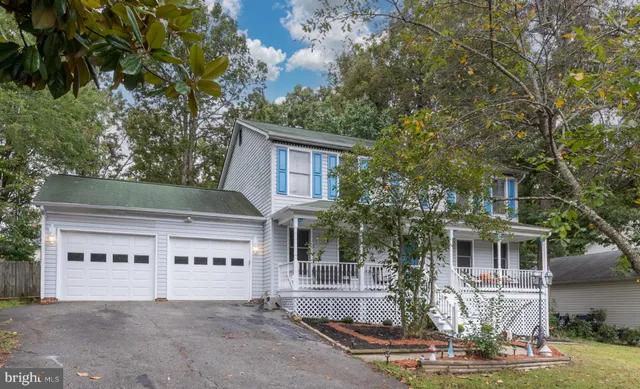 front view of house with a tree