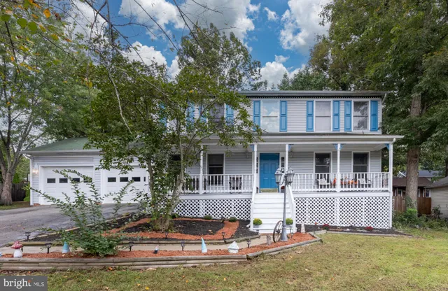 a front view of a house with garage