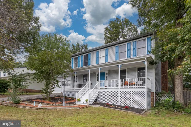 a house with swimming pool in front of it