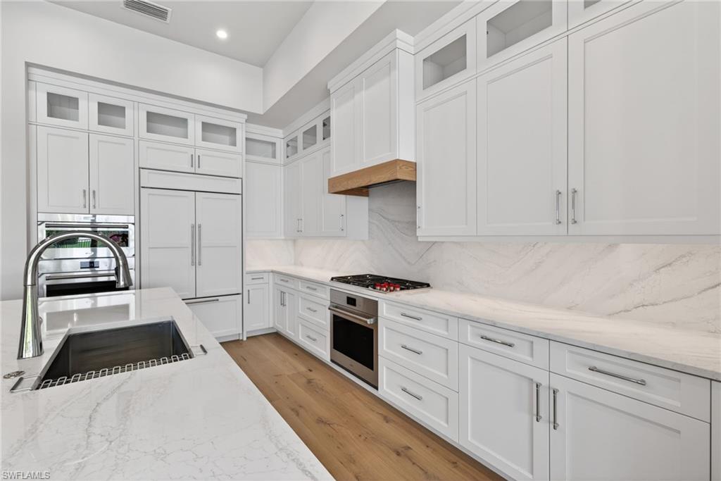 16736 Lucarno Way Naples, FL 34110 - Photo 10 of 49 Stunning kitchen design with all appliances Sub Zero / Wolf Package