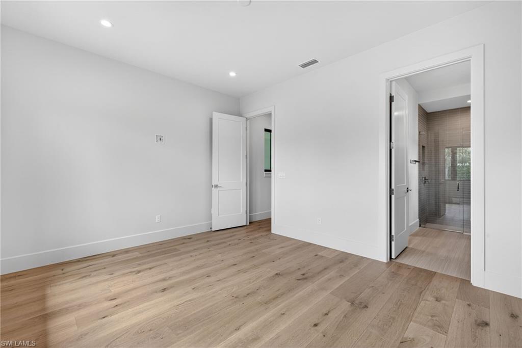 16736 Lucarno Way Naples, FL 34110 - Photo 22 of 49 Bedroom 2 with en suite bathroom and walk-in closet