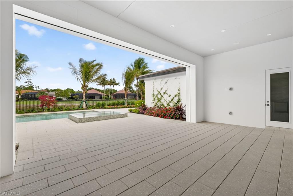 16736 Lucarno Way Naples, FL 34110 - Photo 30 of 49 Large outdoor living space has remote screen