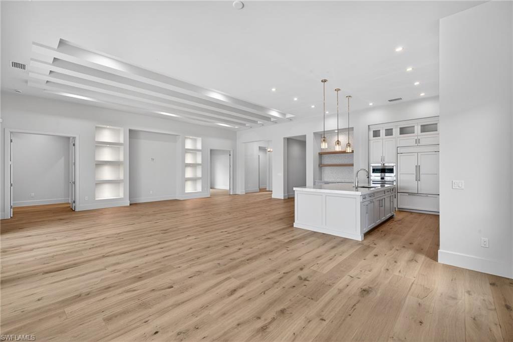 16736 Lucarno Way Naples, FL 34110 - Photo 48 of 49 Large bright open concept floor plan has great flow for family gatherings and entertaining