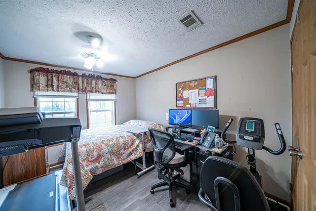 a bedroom with bed and a window