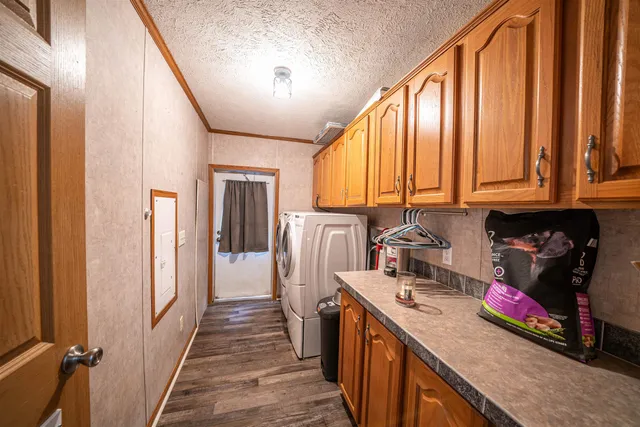 a kitchen with refrigerator a stove and cabinets