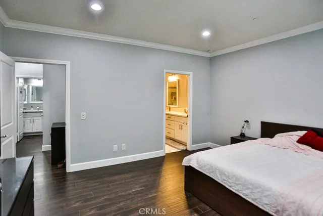 a bedroom with a bed and television