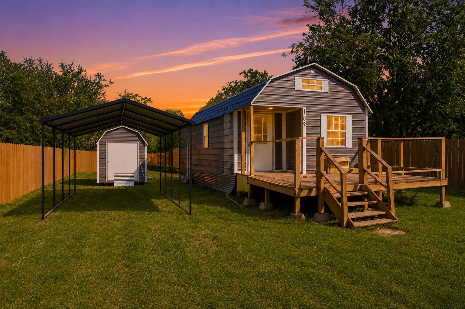 A charming tiny home with a cozy front deck and storage shed. Virtually enhanced image. The black metal carport shown has been digitally added for illustrative purposes only and is not currently installed. Seller intends to install the carport prior to closing.