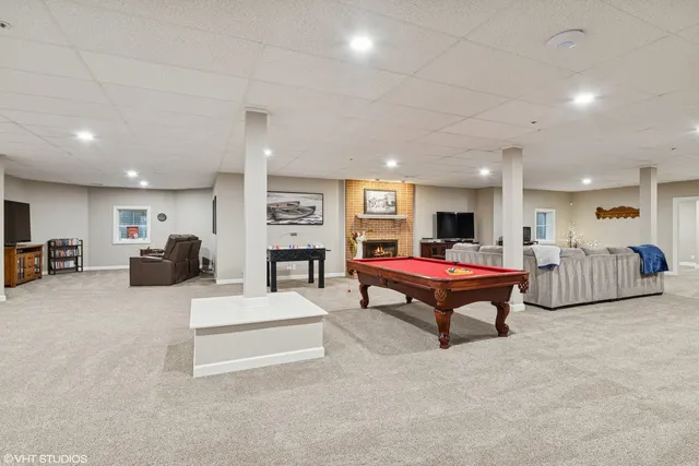 a living room with furniture a table and a flat screen tv