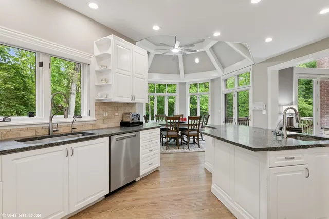 a kitchen with sink cabinets and window