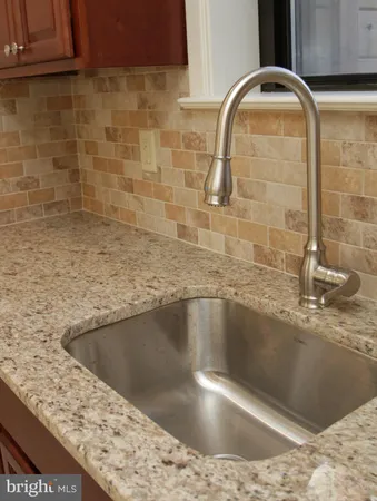 a view of a faucet a sink