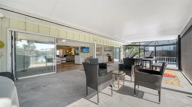 a view of a chair and table on the patio