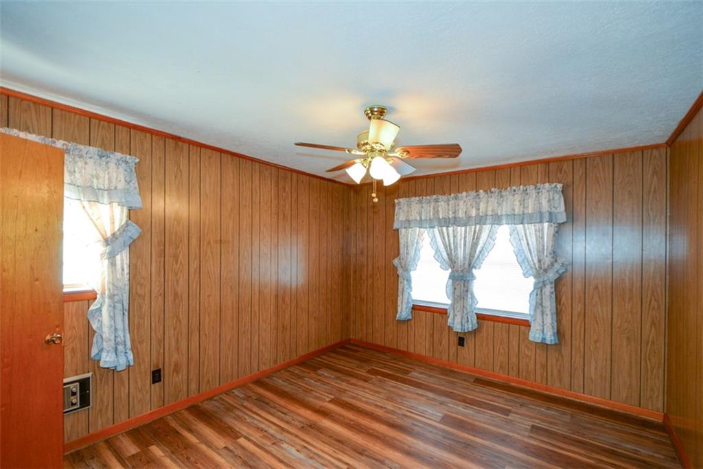 6267 Mt Pisgah Road Ellijay, GA 30540 - Photo 21 of 55 a view of empty room with wooden floor and fan