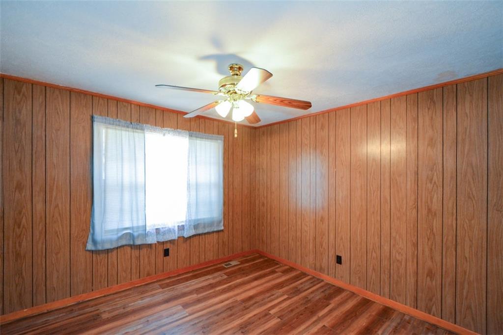 6267 Mt Pisgah Road Ellijay, GA 30540 - Photo 23 of 55 wooden floor in an empty room with a window