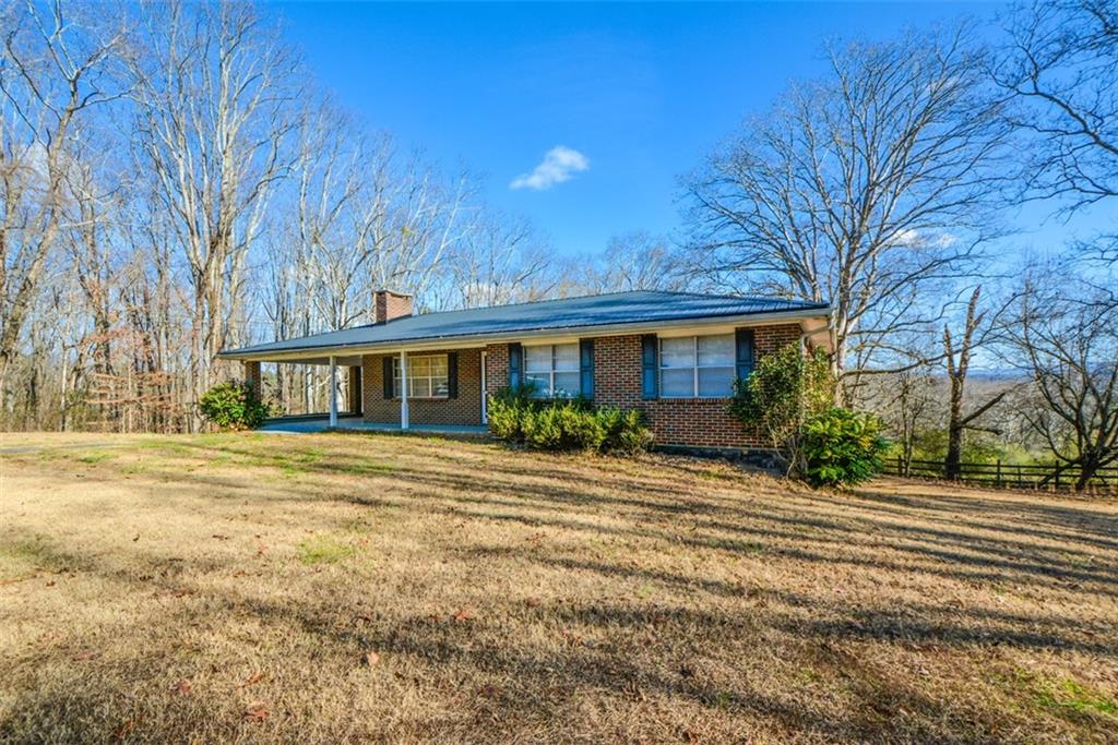6267 Mt Pisgah Road Ellijay, GA 30540 - Photo 3 of 55 a front view of a house with a yard