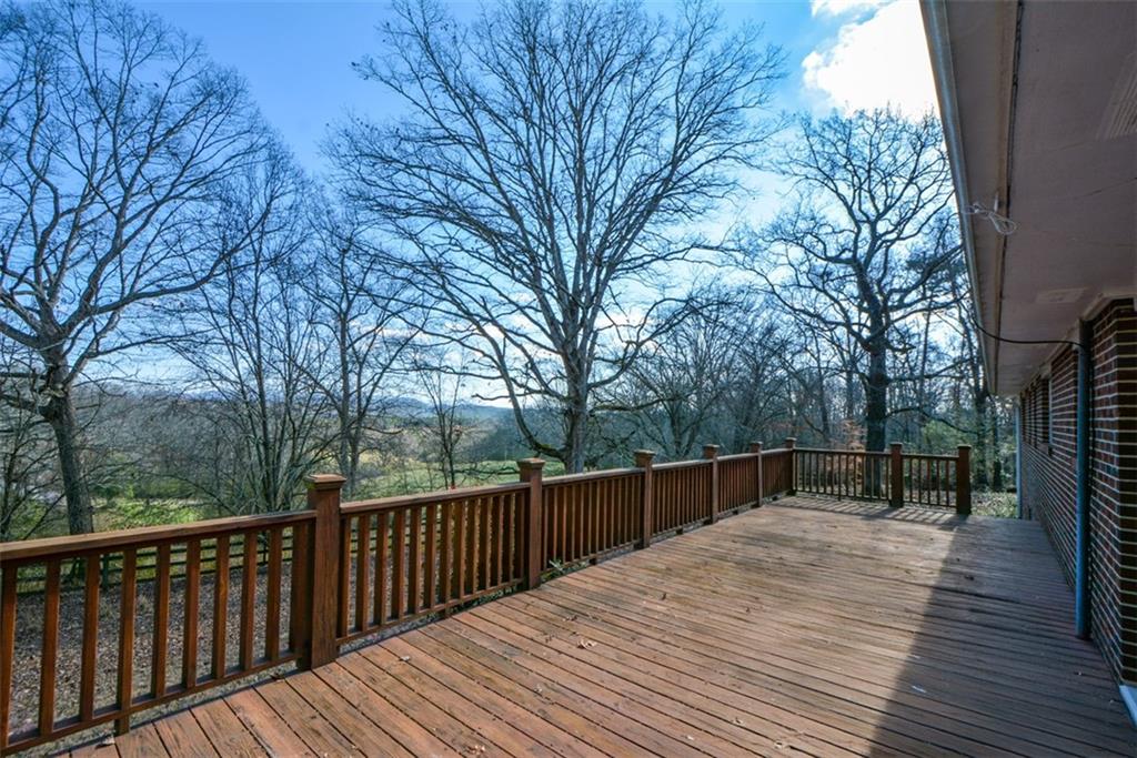 6267 Mt Pisgah Road Ellijay, GA 30540 - Photo 38 of 55 a view of backyard with wooden floor and large trees