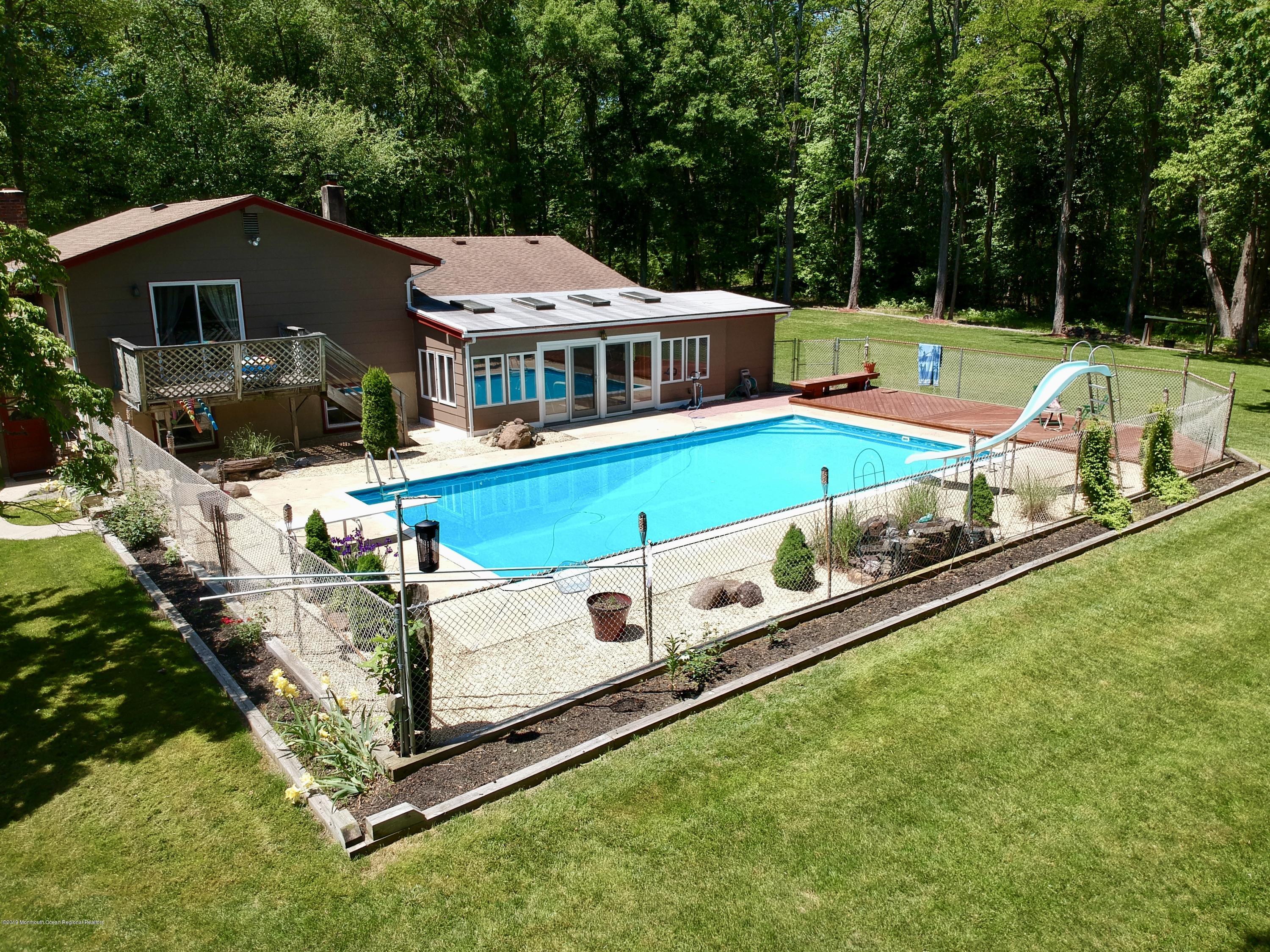 184 Old Tavern Road Farmingdale, NJ 07727 - Photo 5 of 39 a aerial view of a house with a big yard