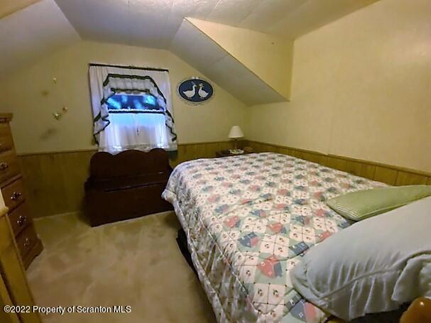 525 State Rte 2010 Union Dale, PA 18470 - Photo 25 of 31 a bedroom with a bed and painting on the wall