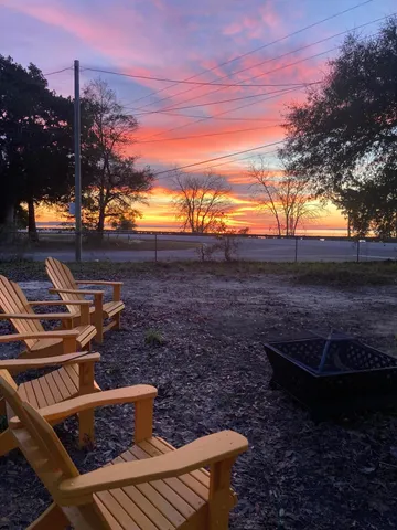 a view of a backyard with sitting area