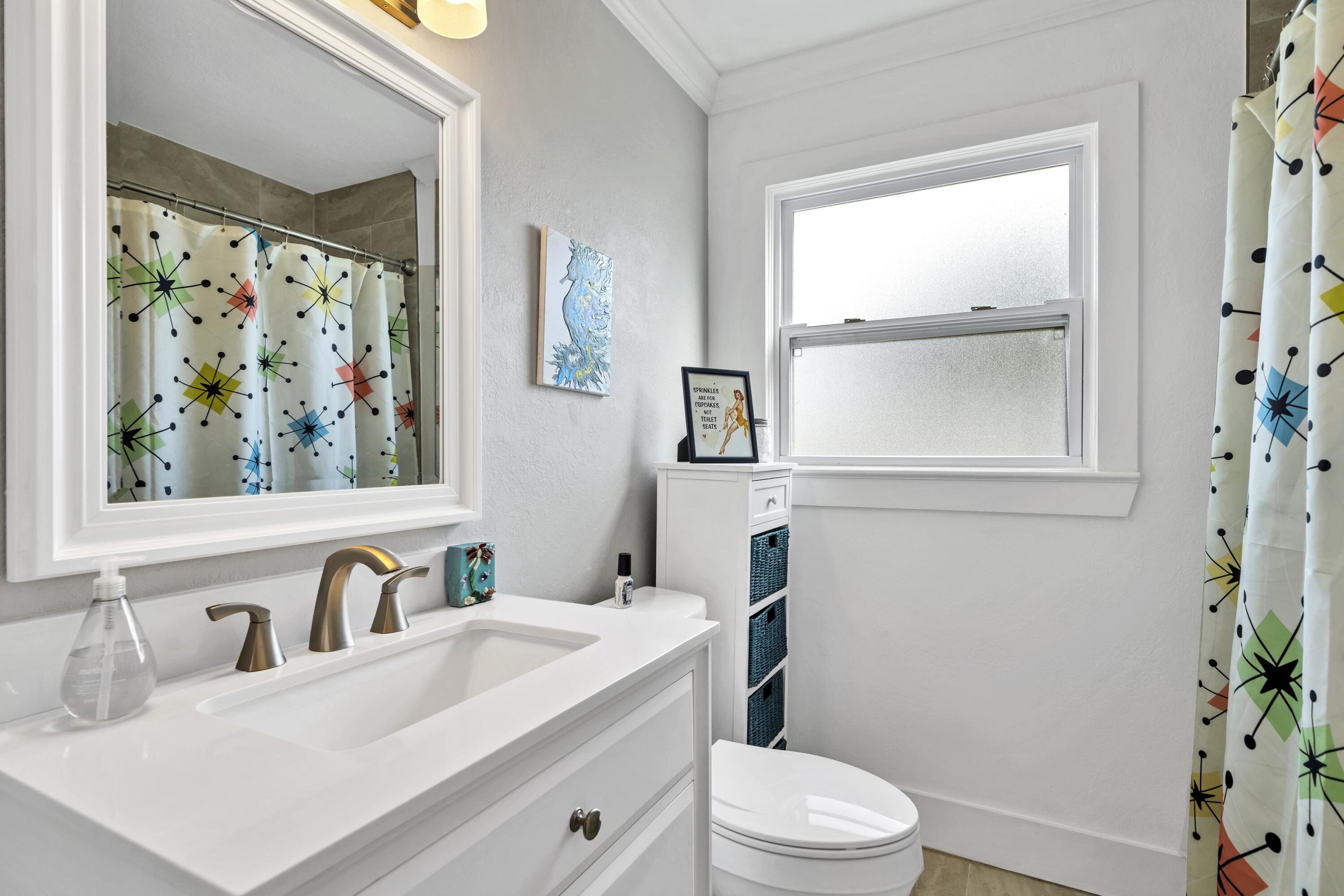 13382 Highway 20 Freeport, FL 32439 - Photo 11 of 43 a bathroom with a sink a toilet and a window