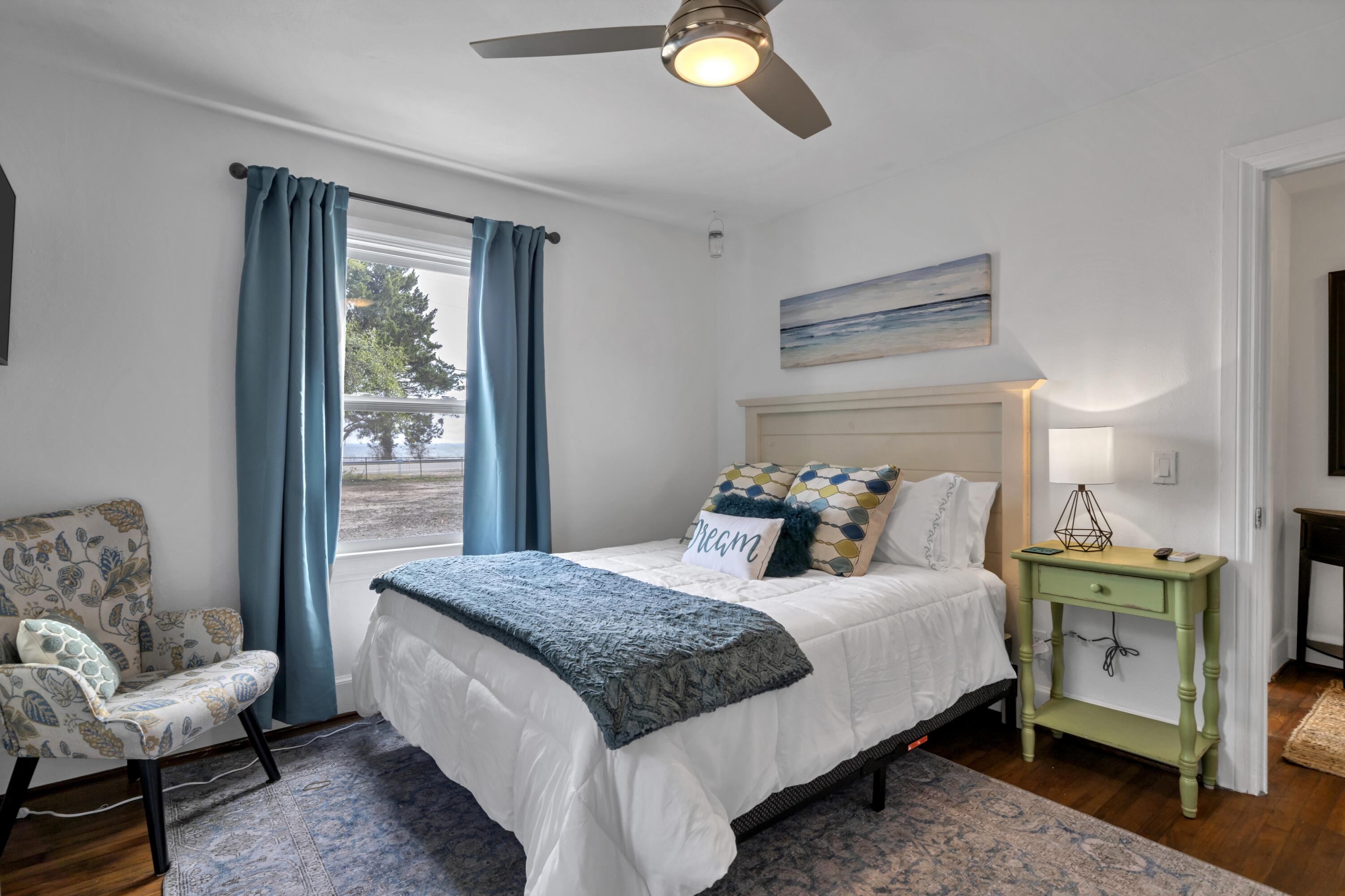 13382 Highway 20 Freeport, FL 32439 - Photo 12 of 43 a bedroom with a bed and a chandelier