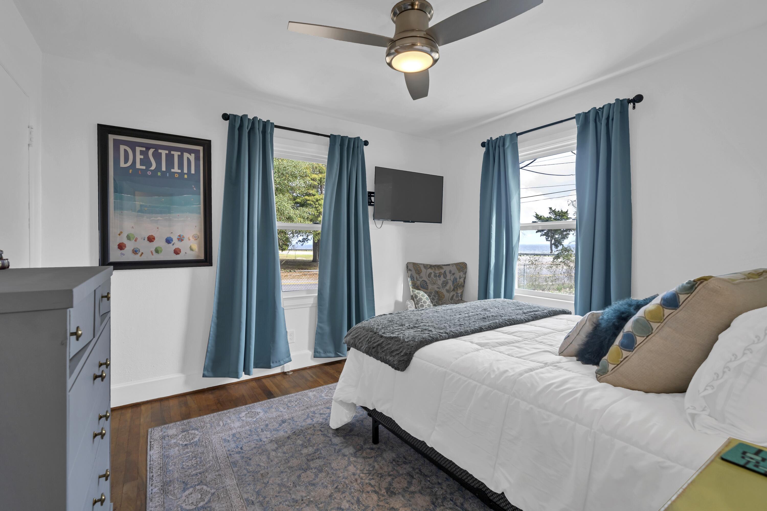 13382 Highway 20 Freeport, FL 32439 - Photo 13 of 43 a bedroom with a bed and a dresser next to a window